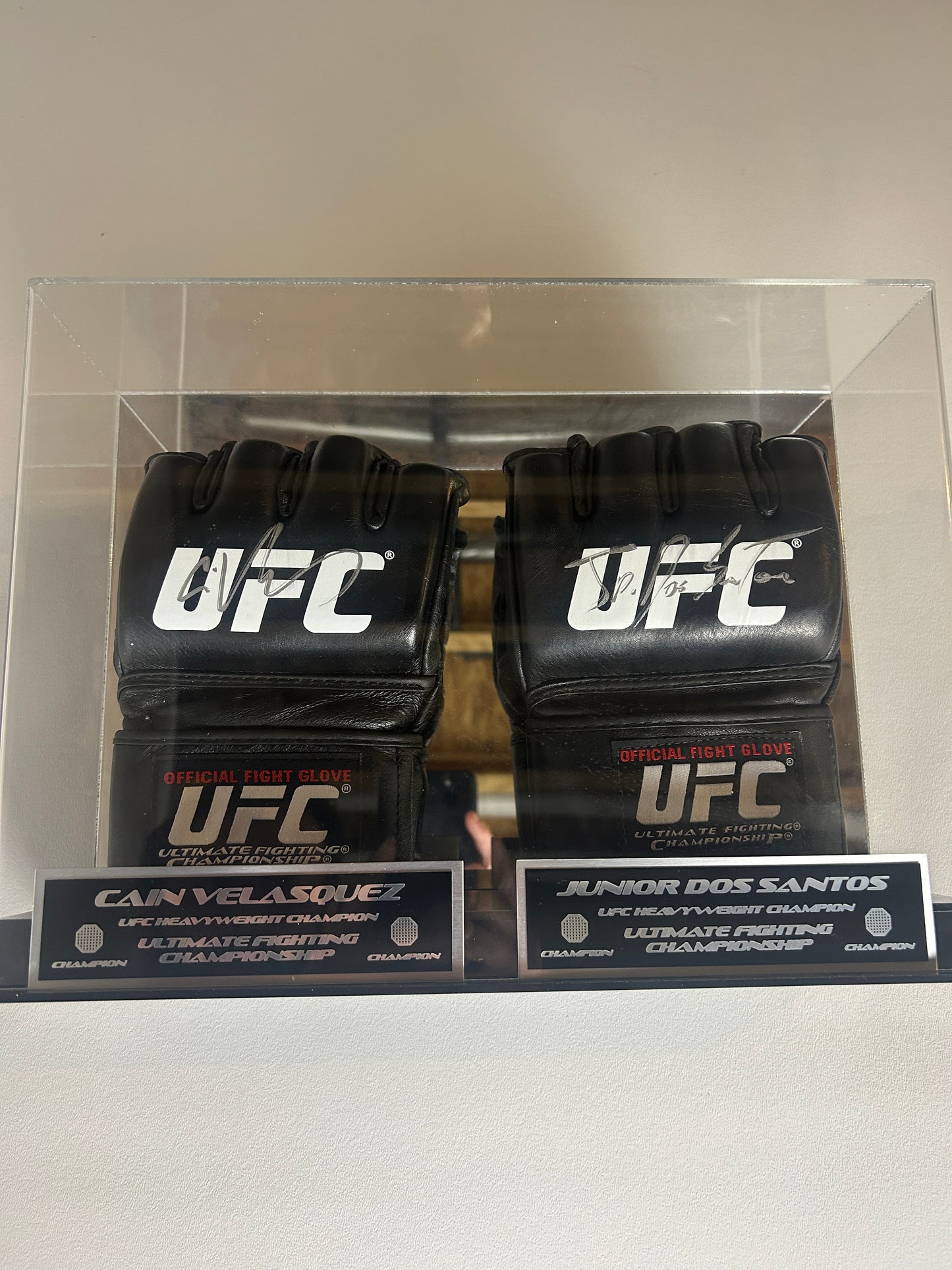 Cain Velasquez and Junior Dos Santos Signed Gloves